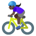 🚴🏿‍♀️ woman biking: dark skin tone display on Google